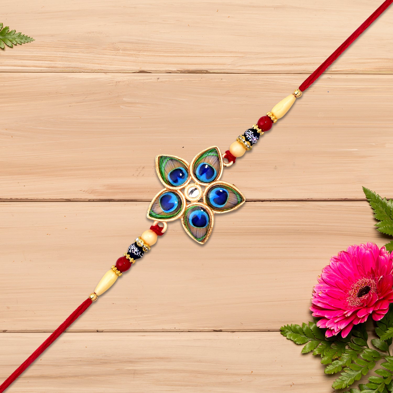 Designer Mor Pankh Rakhi In Star Shape Designer Mor Pankh Rakhi In Star Shape